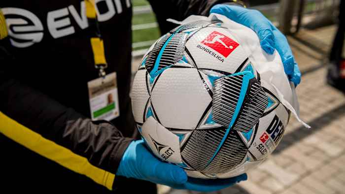The game ball gets wiped before Dortmund vs. Schalke